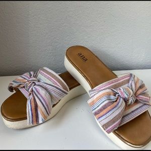 White platform bow sandals